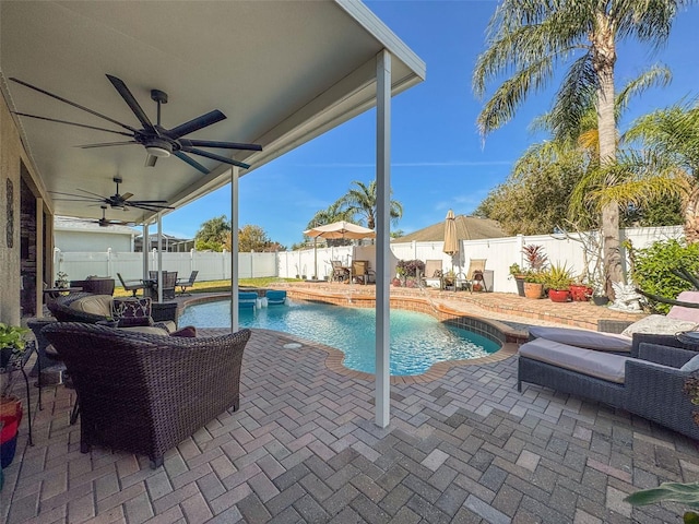 view of pool featuring a patio and ceiling fan