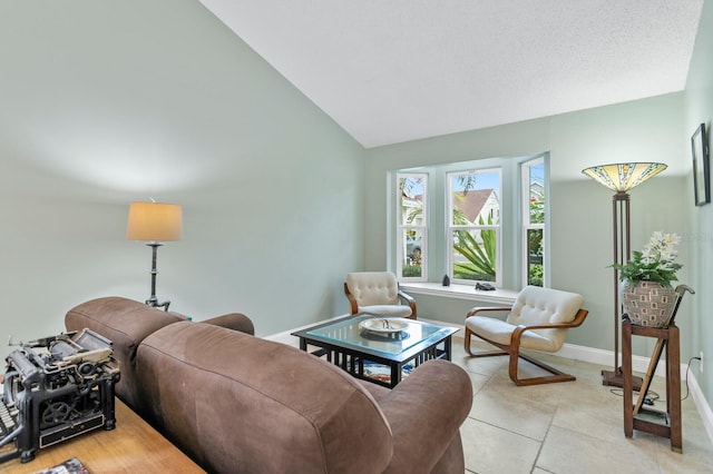 living room with vaulted ceiling and light tile patterned floors