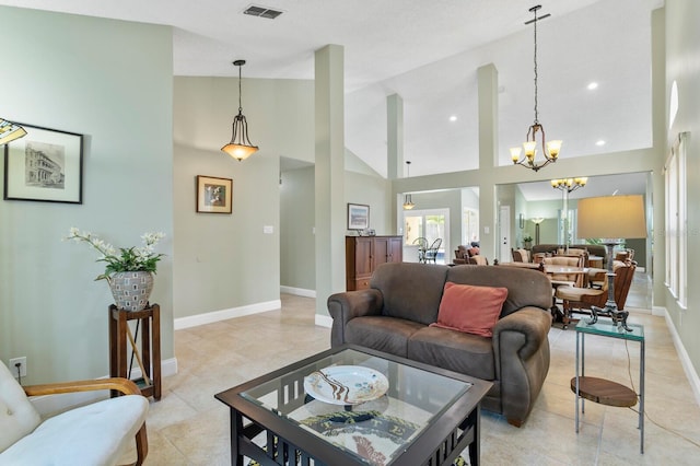 living room featuring high vaulted ceiling, a chandelier, and light tile patterned flooring