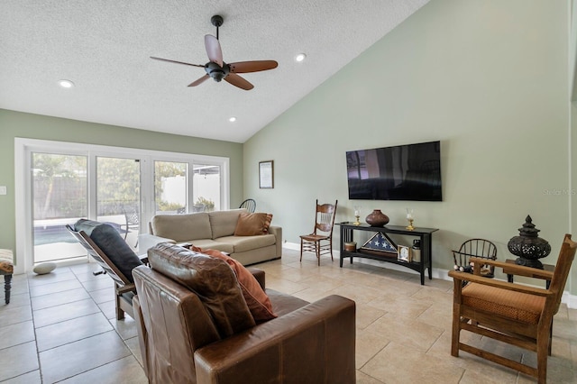 living room with ceiling fan, high vaulted ceiling, a textured ceiling, and light tile patterned floors