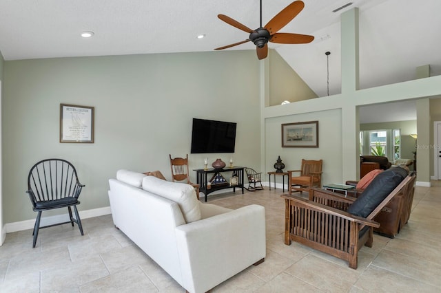 tiled living room featuring high vaulted ceiling and ceiling fan