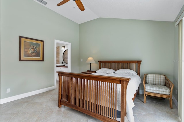 tiled bedroom with ensuite bath, vaulted ceiling, and ceiling fan