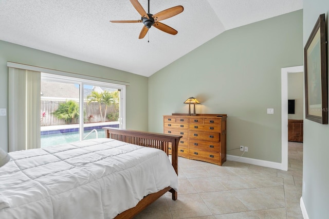 bedroom featuring lofted ceiling, light tile patterned floors, a textured ceiling, and ceiling fan