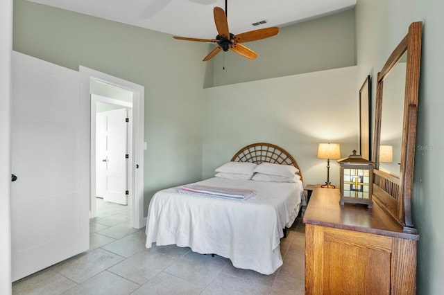 tiled bedroom with a towering ceiling