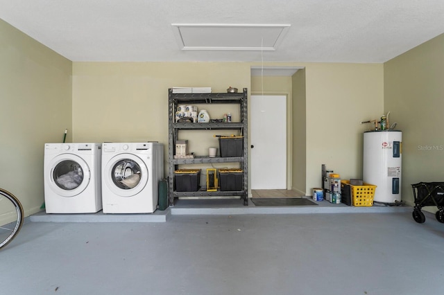 garage featuring washer and dryer and electric water heater