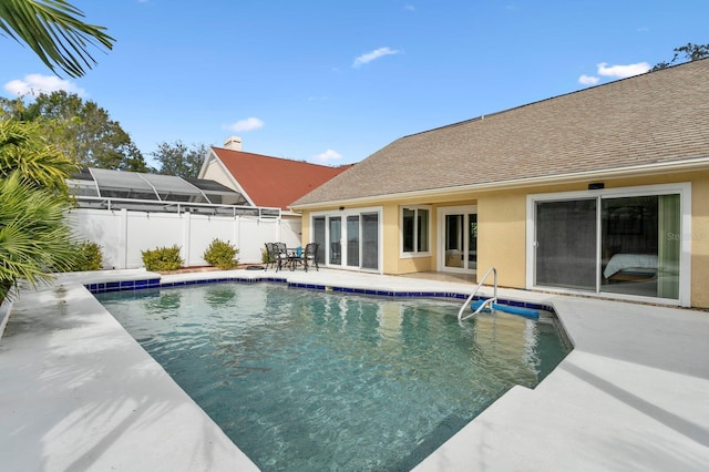 view of swimming pool featuring a patio area