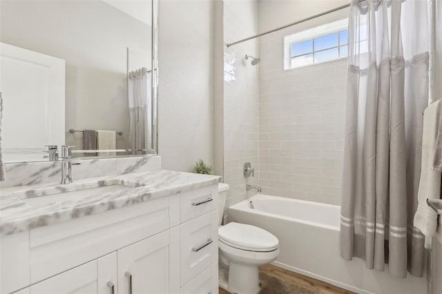 full bathroom featuring shower / tub combo with curtain, vanity, toilet, and wood-type flooring