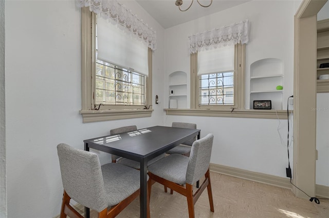 dining area with a wealth of natural light and built in features