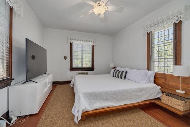 bedroom featuring dark wood-type flooring and ceiling fan