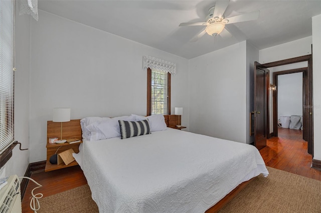 bedroom featuring dark hardwood / wood-style flooring and ceiling fan