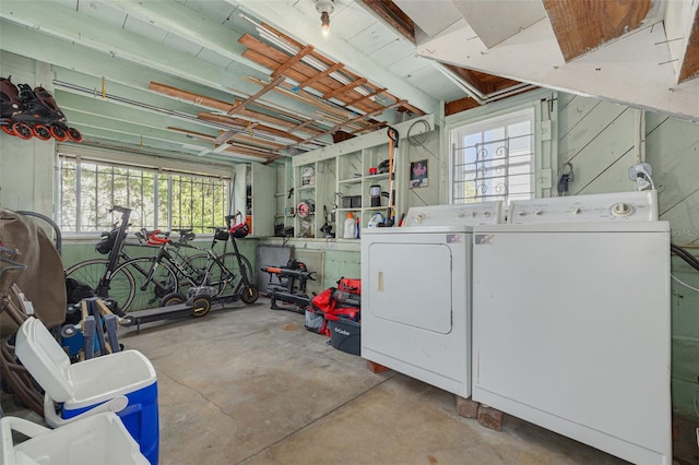 laundry room with separate washer and dryer and a wealth of natural light