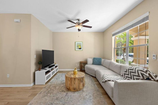 living room featuring ceiling fan and light wood-type flooring