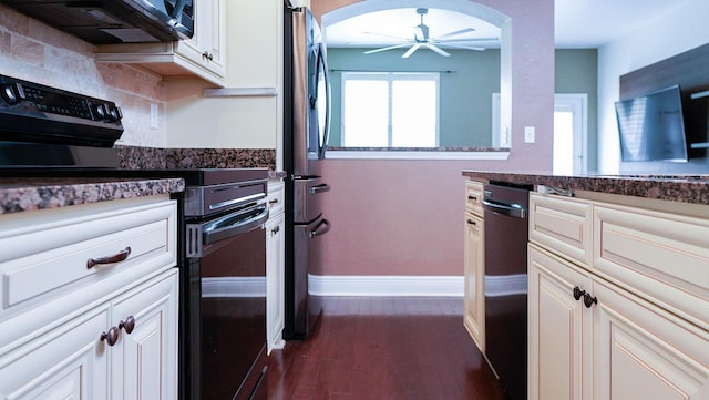 kitchen featuring ceiling fan, dark hardwood / wood-style flooring, decorative backsplash, and black appliances