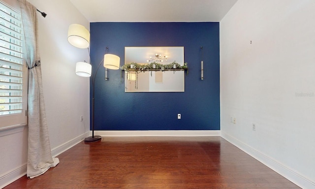 spare room featuring hardwood / wood-style floors