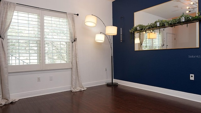 unfurnished room featuring dark hardwood / wood-style floors