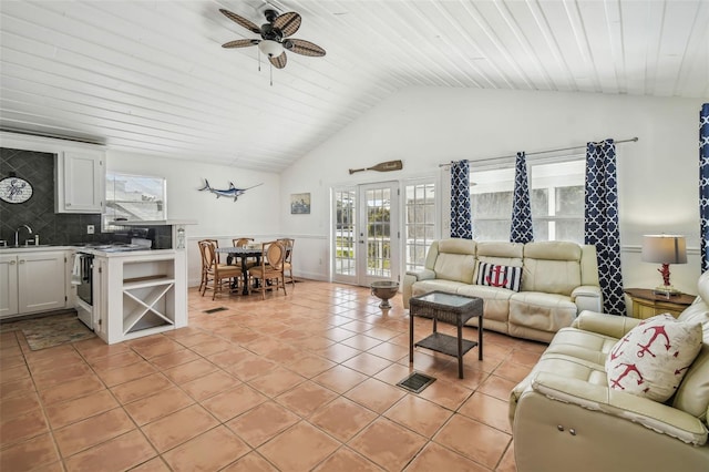 tiled living room with french doors, lofted ceiling, sink, wooden ceiling, and ceiling fan