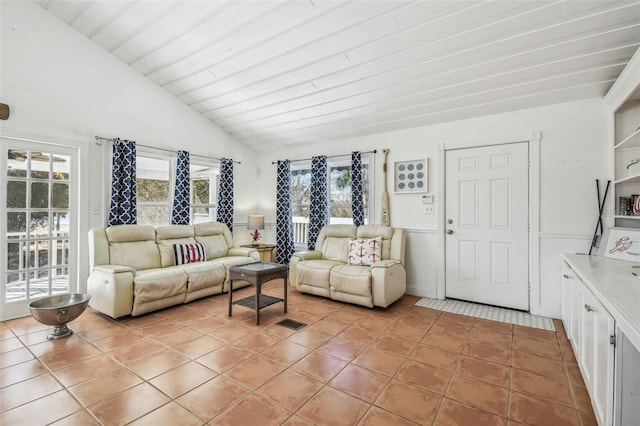 tiled living room with vaulted ceiling