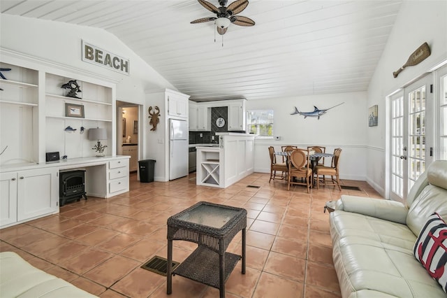 tiled living room with lofted ceiling, wood ceiling, ceiling fan, and french doors