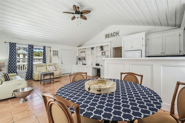 dining area featuring lofted ceiling, light tile patterned floors, wood ceiling, and ceiling fan