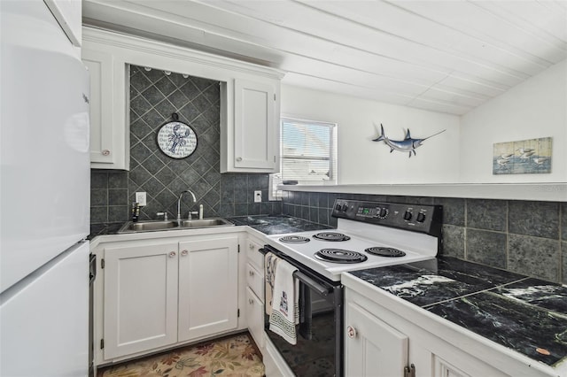 kitchen with white cabinets, sink, white fridge, and range with electric stovetop