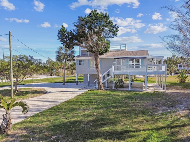 exterior space with a carport, a yard, and covered porch