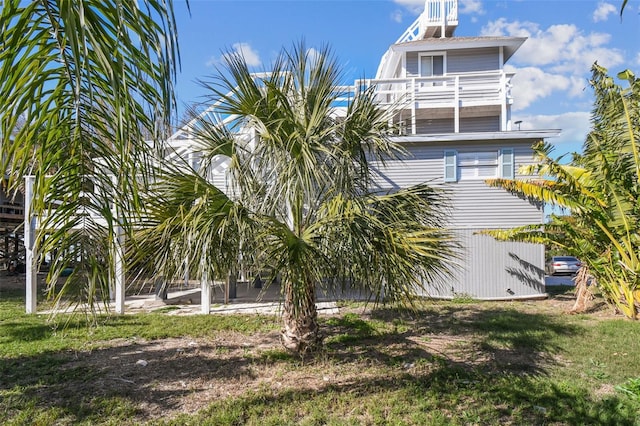 back of house with a balcony