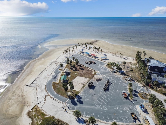 aerial view with a water view and a beach view