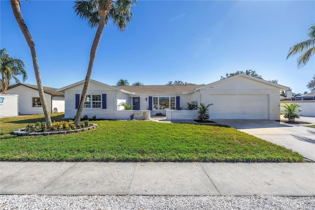 single story home featuring concrete driveway, a front lawn, and an attached garage