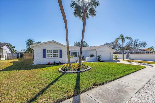 ranch-style house with driveway, an attached garage, fence, and a front yard