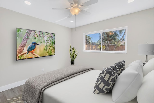 bedroom featuring hardwood / wood-style floors and ceiling fan