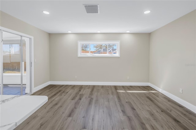 empty room with light wood-type flooring