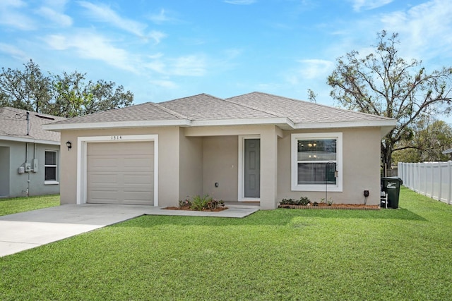 view of front facade featuring a garage and a front yard