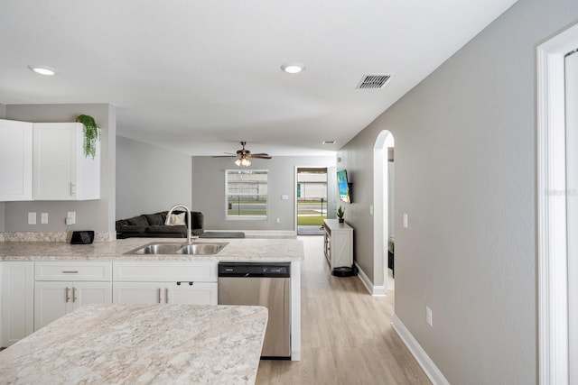 kitchen featuring dishwasher, sink, white cabinets, and light hardwood / wood-style flooring