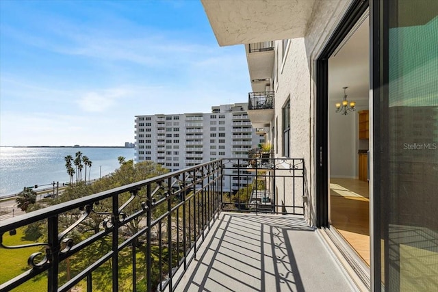 balcony featuring a water view