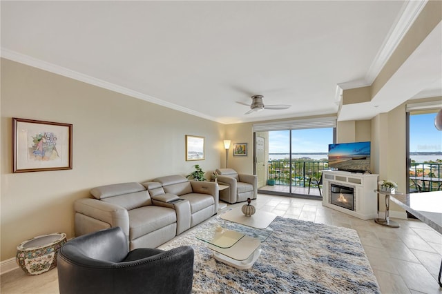 tiled living room featuring ornamental molding and ceiling fan