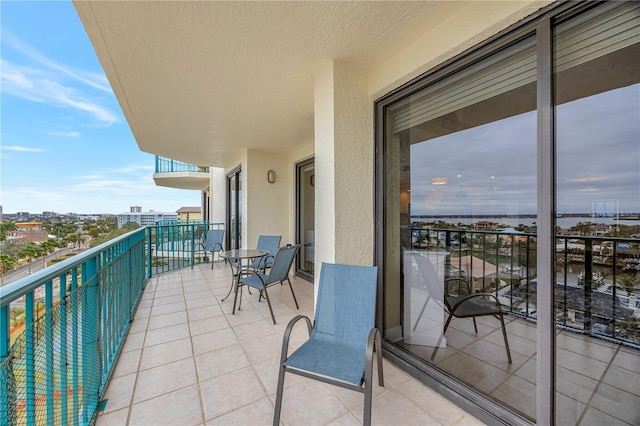 balcony featuring a water view