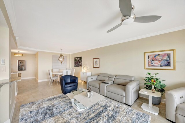 living room with crown molding and ceiling fan