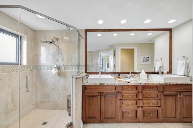 bathroom with vanity and an enclosed shower