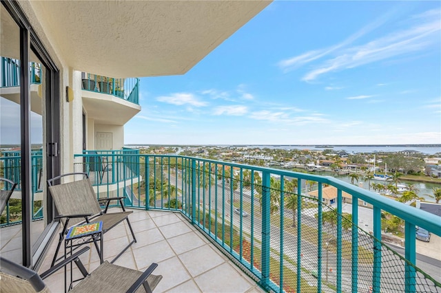 balcony featuring a water view