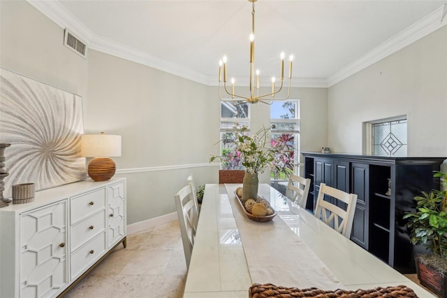 dining space with ornamental molding and a notable chandelier