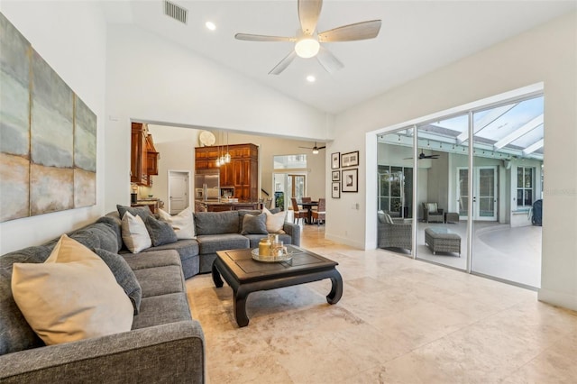 living room featuring high vaulted ceiling and ceiling fan