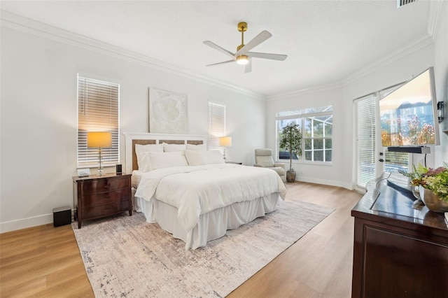 bedroom featuring ornamental molding, ceiling fan, access to exterior, and light hardwood / wood-style floors