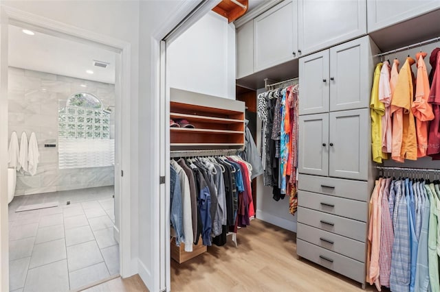 walk in closet featuring light hardwood / wood-style floors