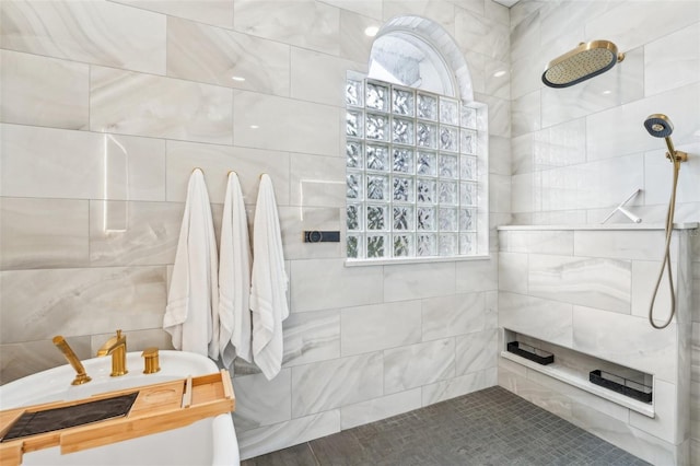 bathroom featuring a wealth of natural light and a tile shower