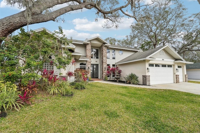 view of front facade with a garage and a front lawn