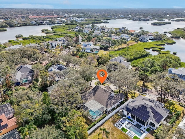 drone / aerial view with a residential view and a water view