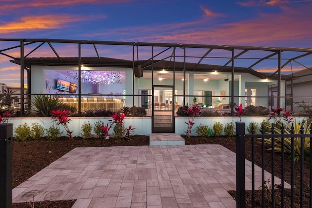 patio terrace at dusk with glass enclosure