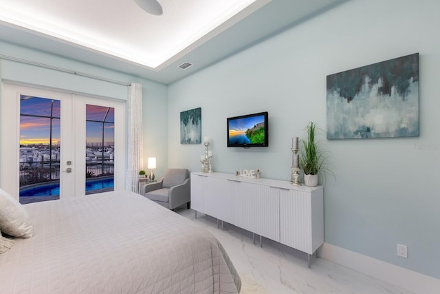 bedroom featuring access to exterior, french doors, and ceiling fan