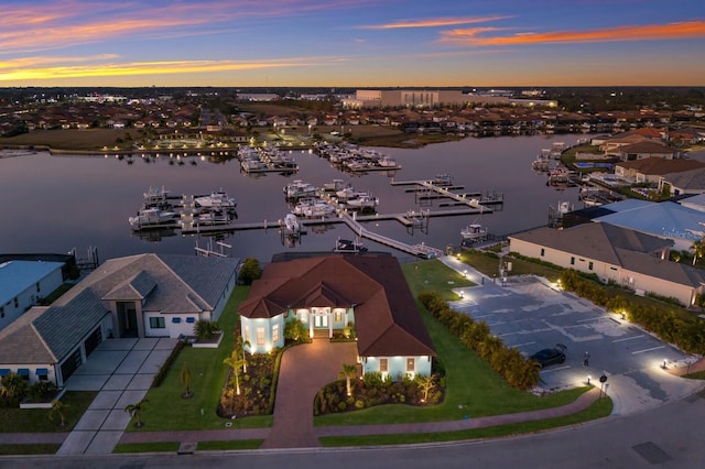 aerial view at dusk with a water view