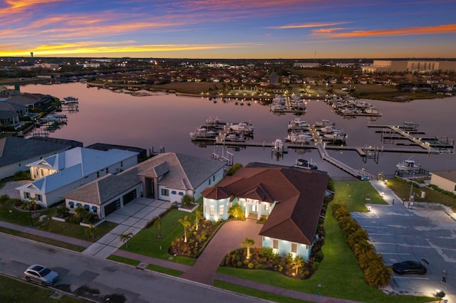 aerial view at dusk with a water view